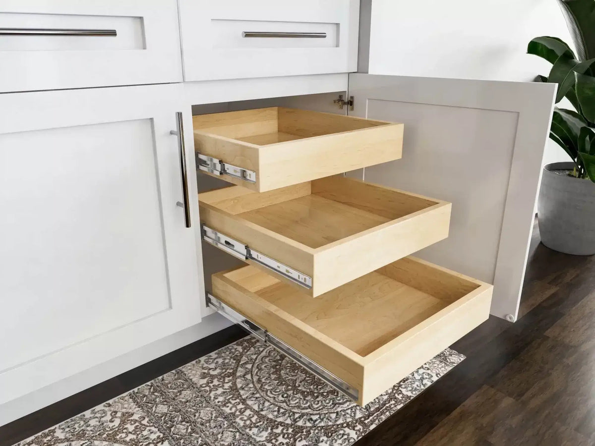 Maple roll-out trays in an open shaker base cabinet